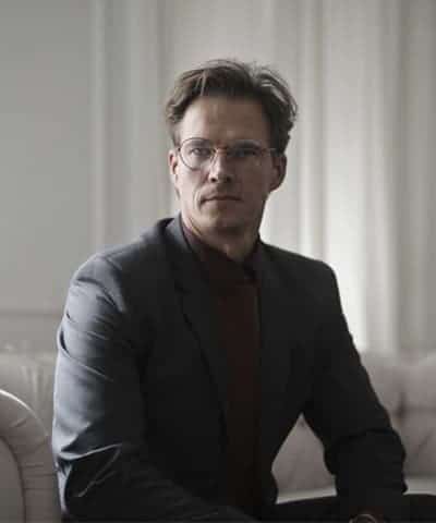 well dressed businessman sitting on sofa well dressed businessman sitting on sofa